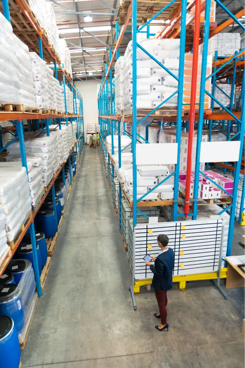 A person checking warehouse racking system